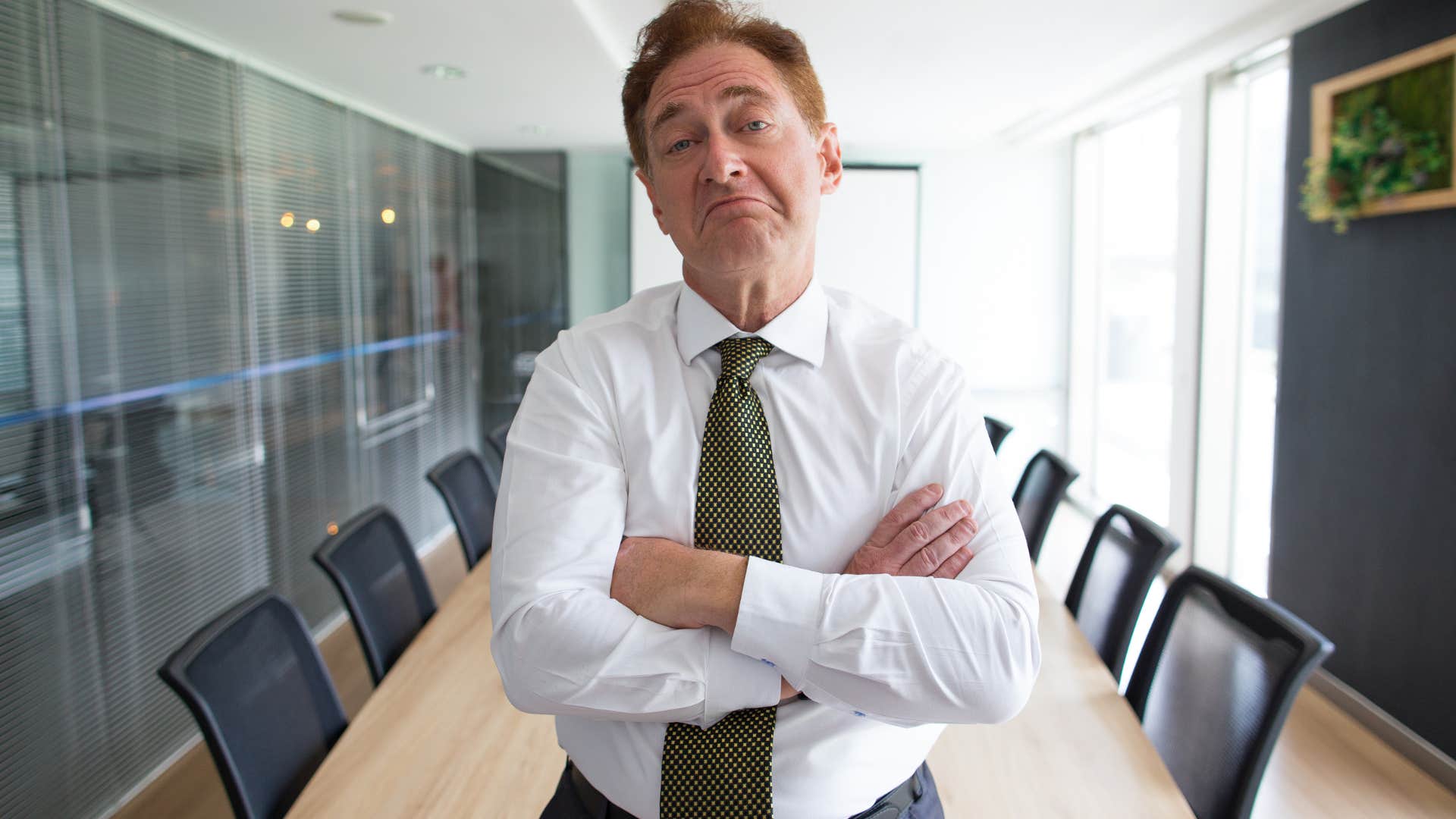 man expressing overconfidence at work
