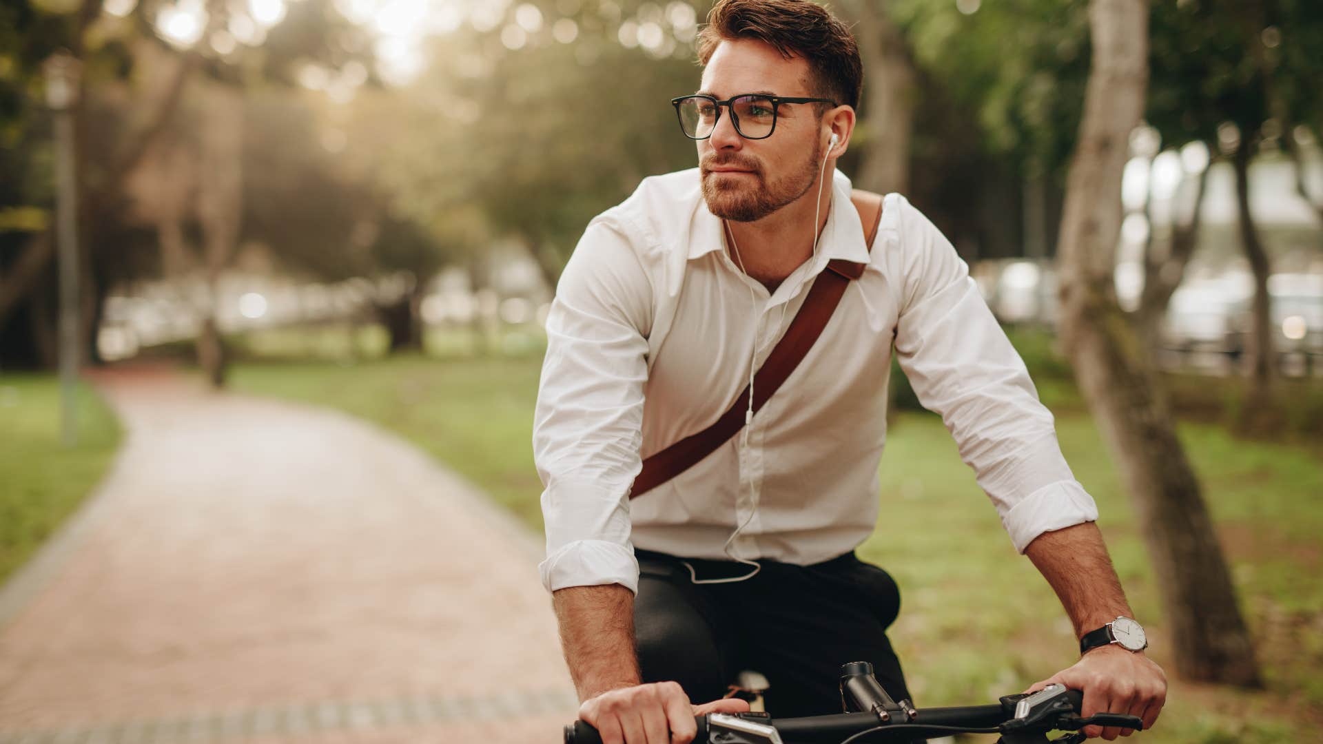 man lacking common sense riding a bike not wearing a helmet