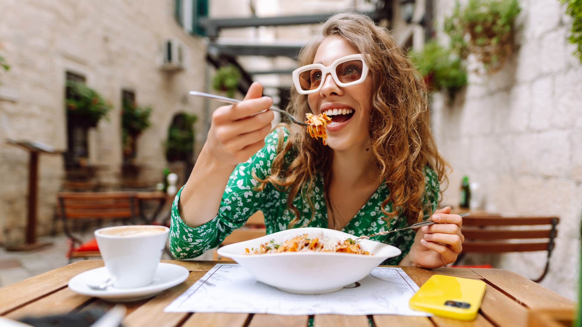 woman eating out regularly at a restaurant