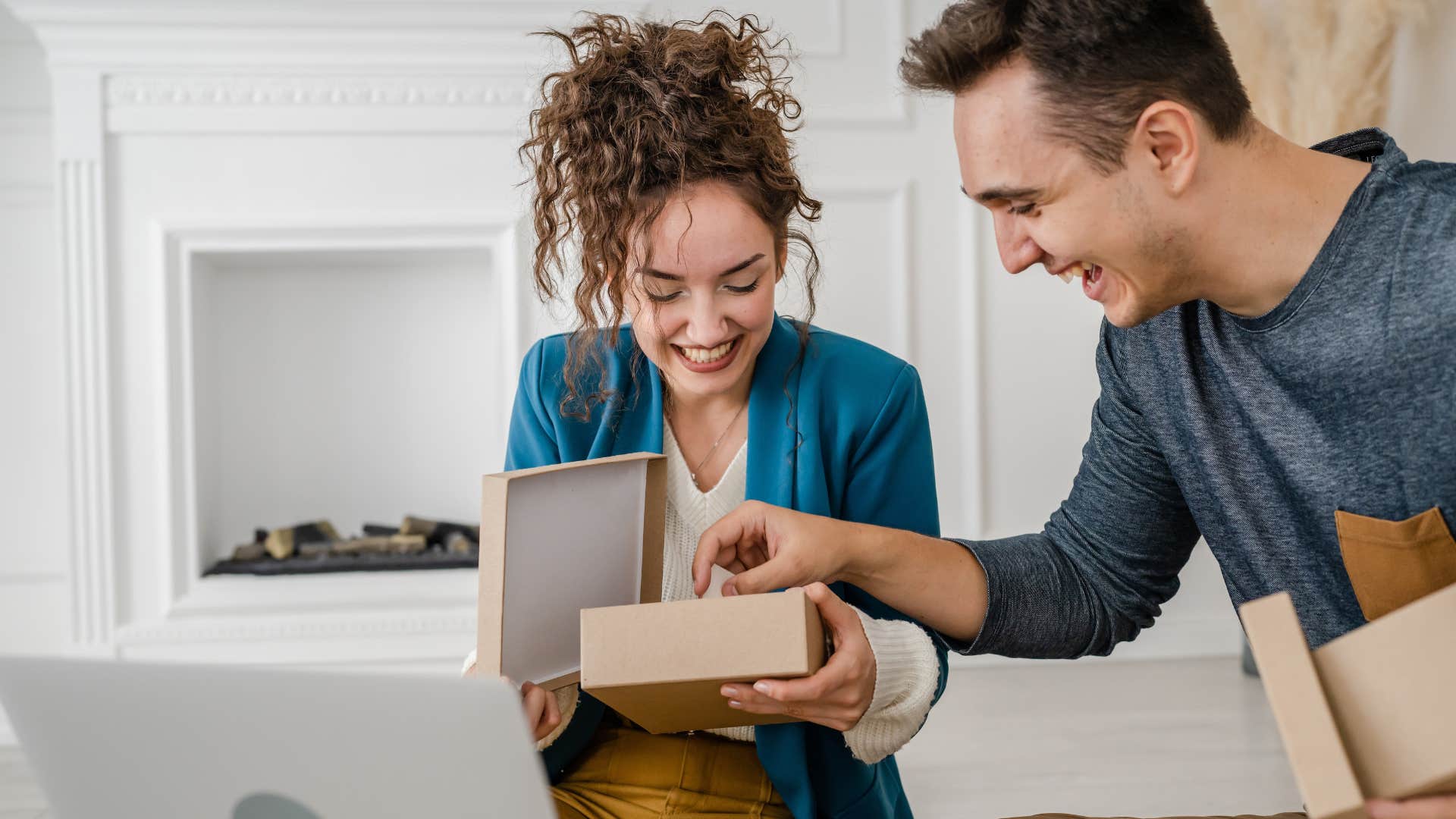 man smiling with his wife after overspending on gift for her