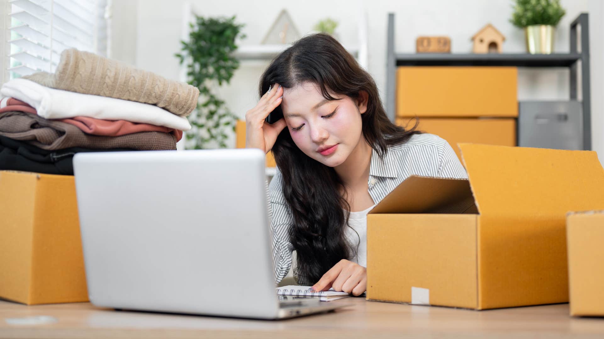 woman shopping impulsively online from her laptop