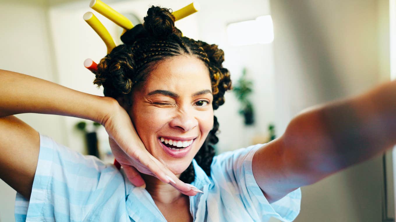 People Who Still Enjoy These 8 Childish Things Are Happier Than Everyone Else extremely happy woman being silly having childish fun