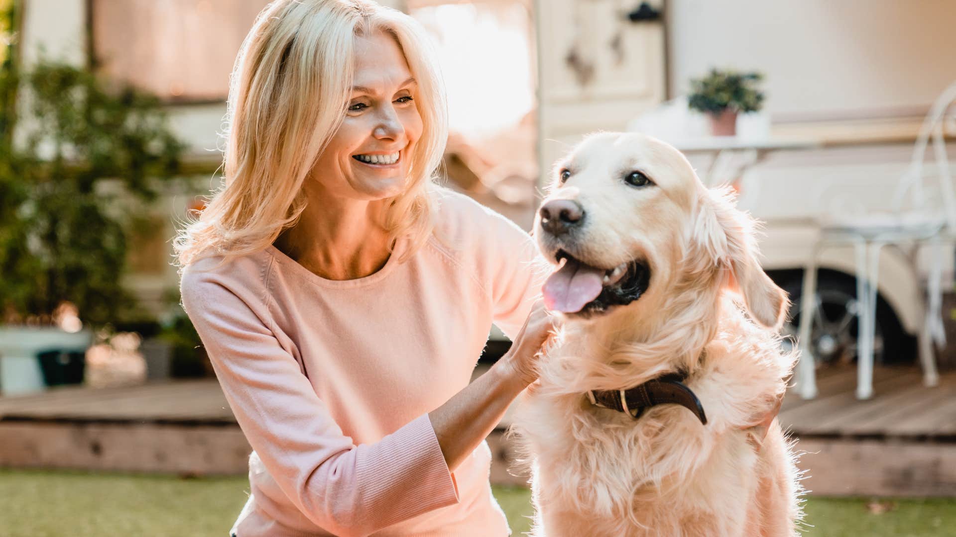woman who doesn't feel judged smiling with her dog