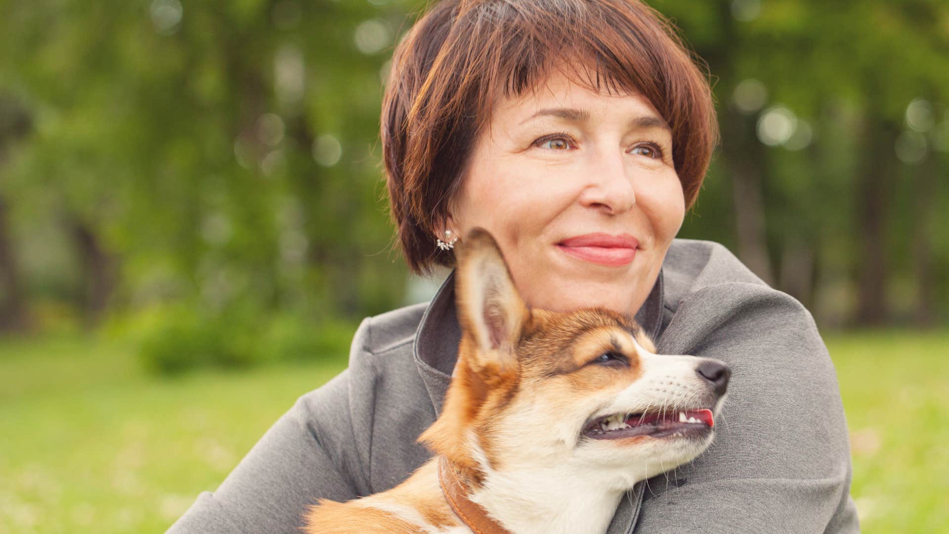 happy woman who has a sense of purpose with her dog