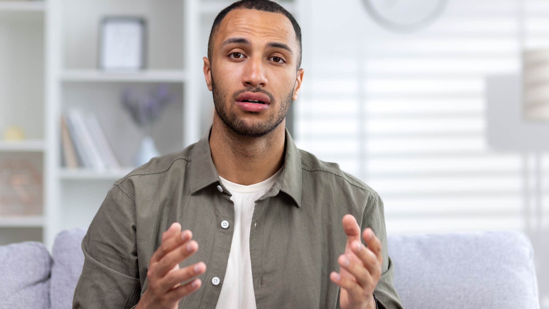 Man having debates with people behind the camera.