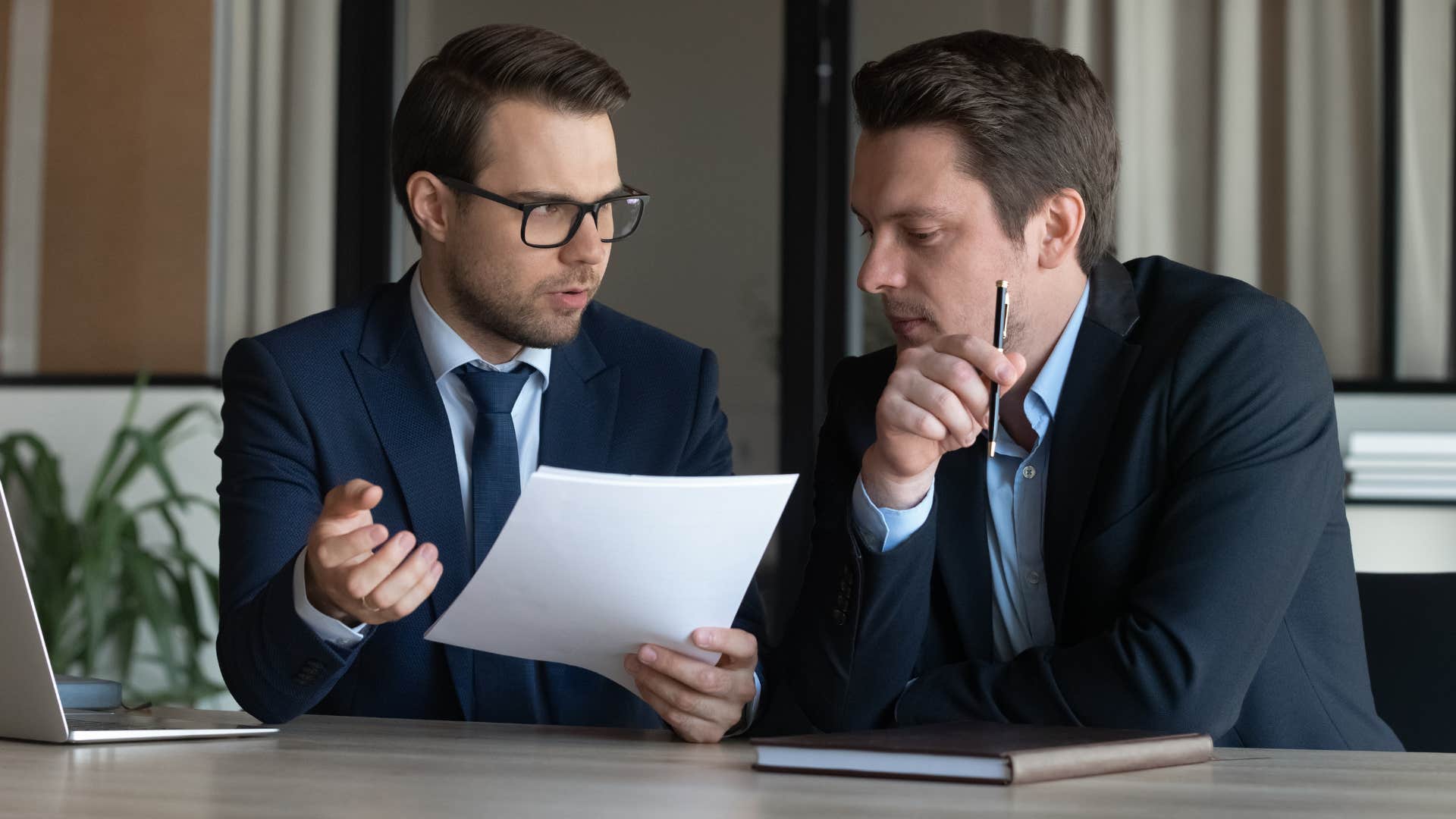 Man asking questions before trying to find an answer with his boss.