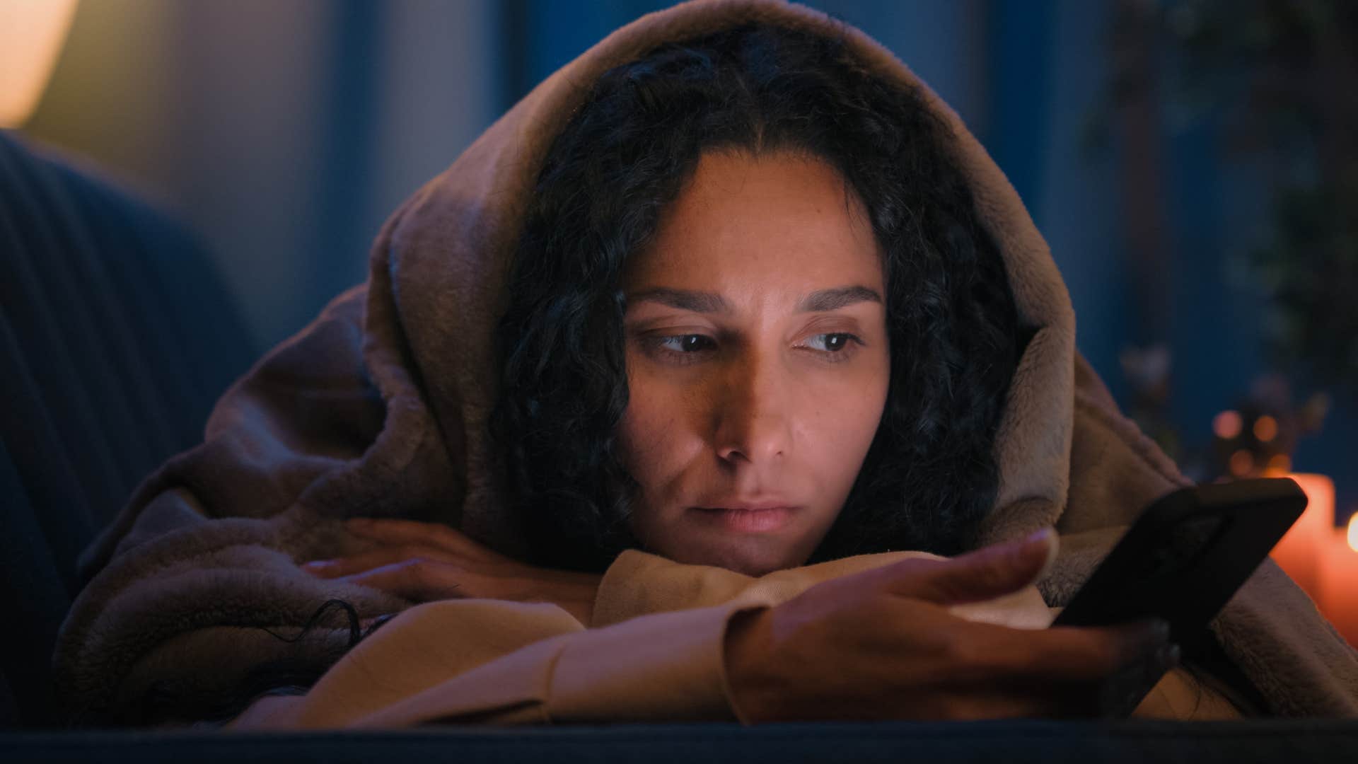 Woman spending too much time online at night.