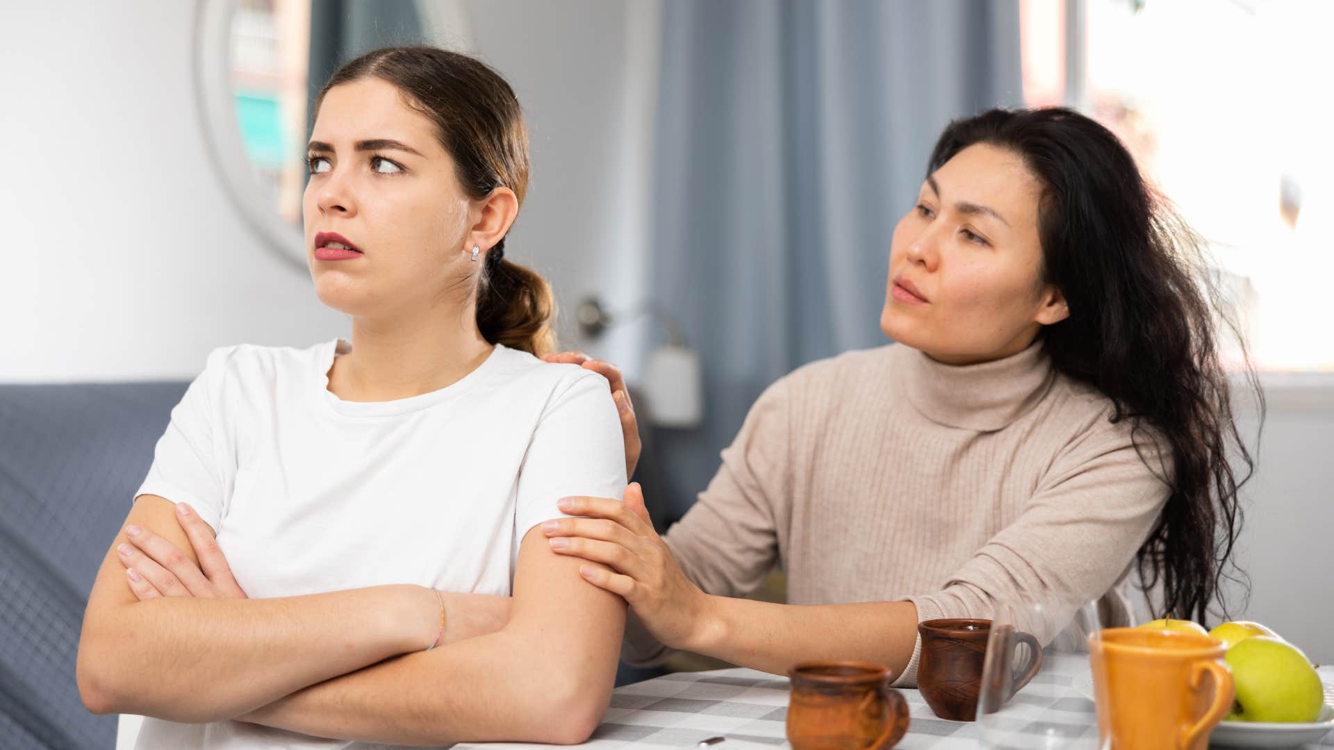 woman trying to convince her friend that she's not upset