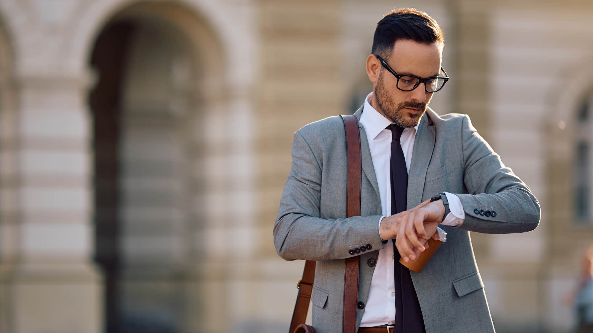 man checking watch thinking he doesnt have time