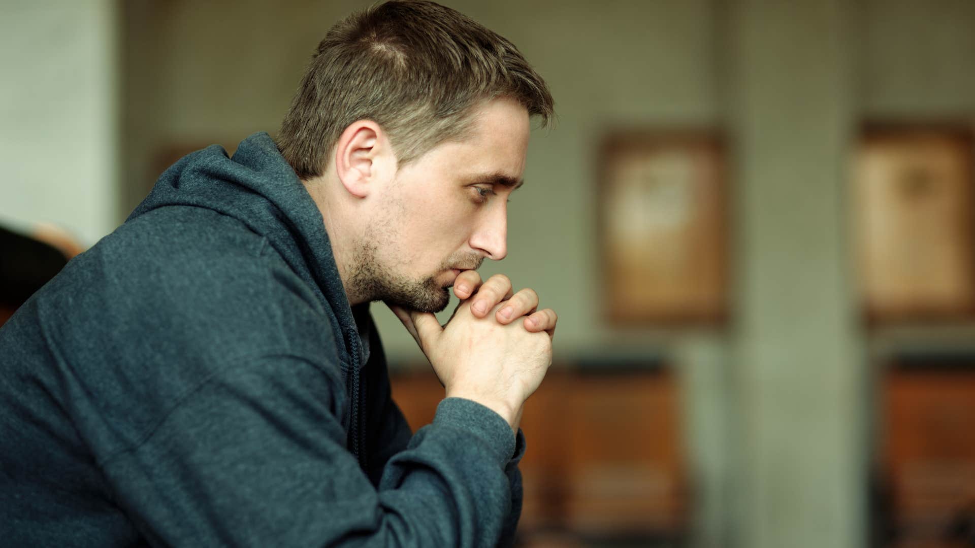 man reflecting thinking it's too risky to take financial chance