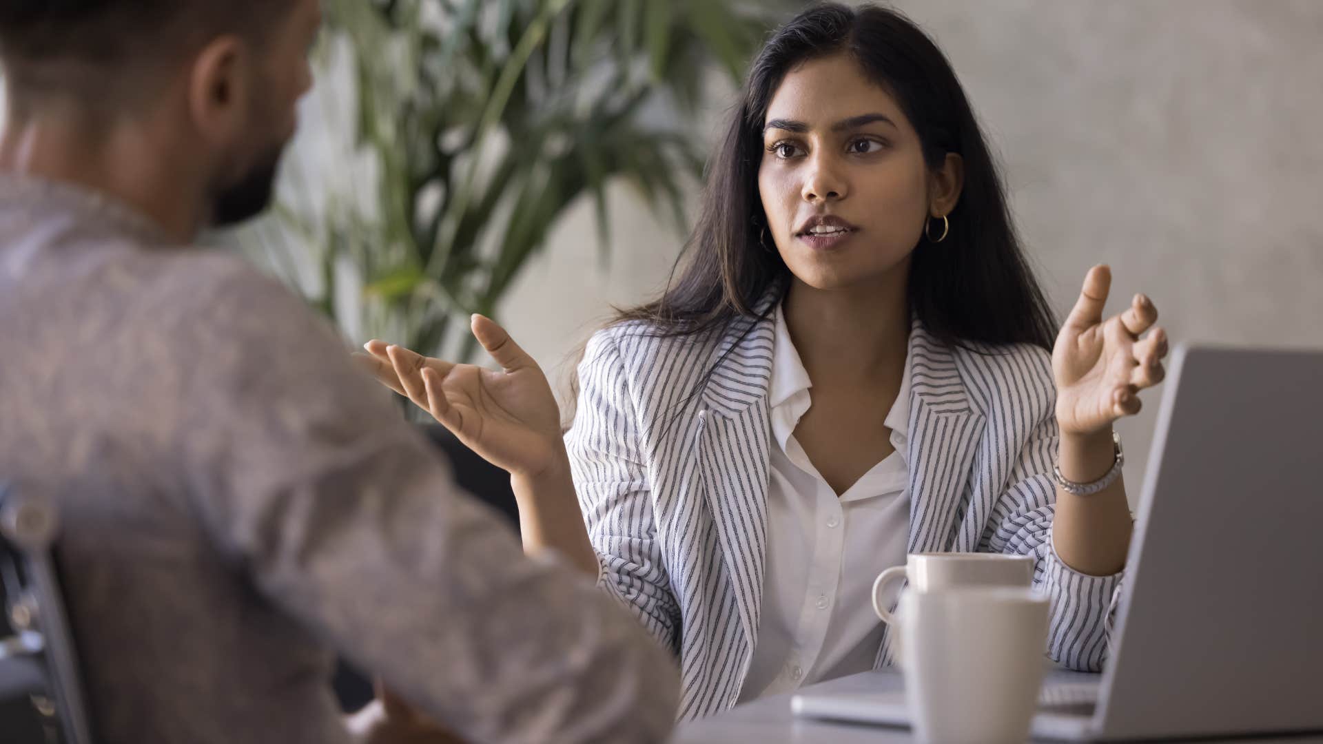 defensive lazy woman saying everyone else can do it to her co-worker