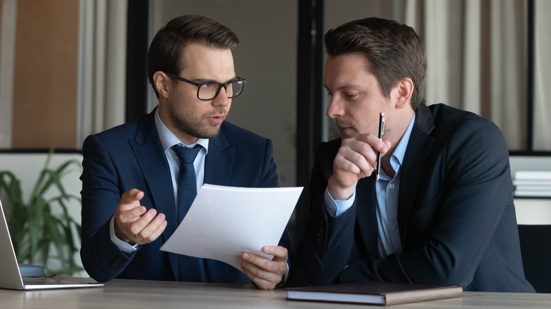 man offering colleague advice