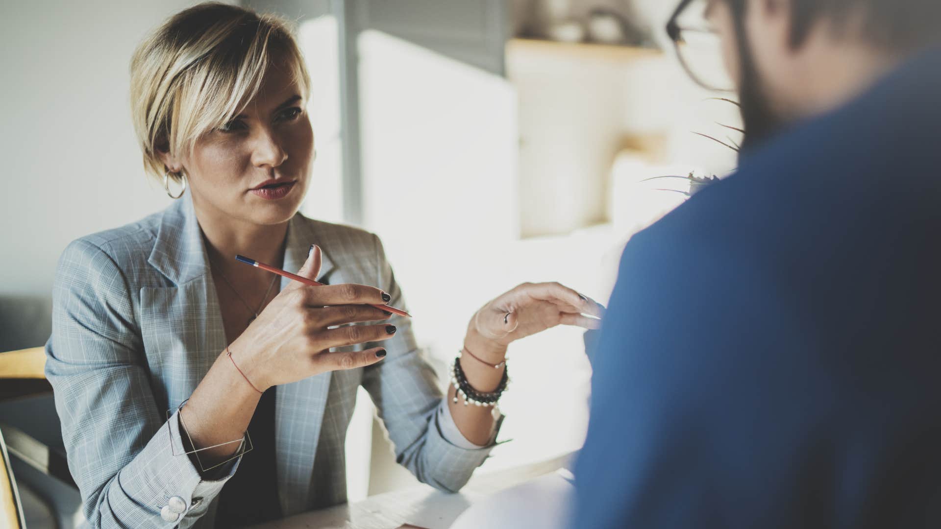 woman asking what are you actually working on to employee