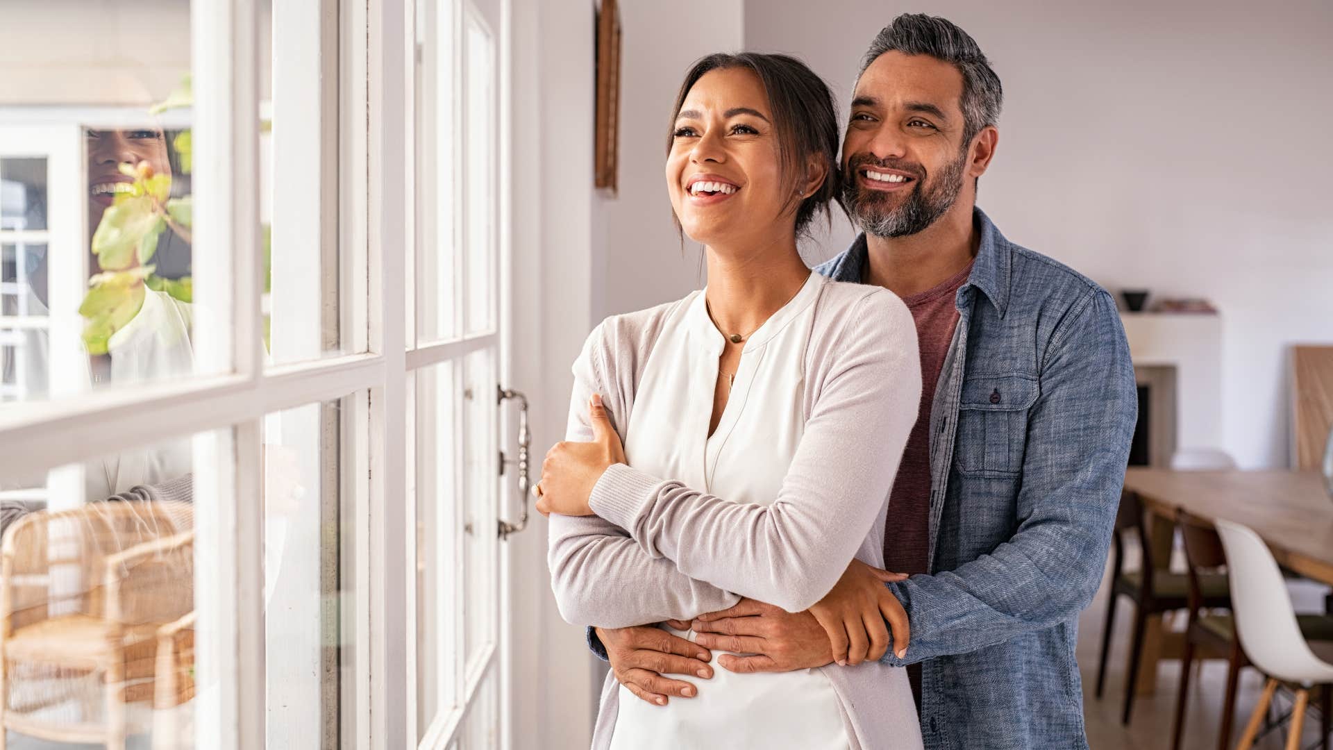 woman in white shirt smiling as their love feels as easy as breathing