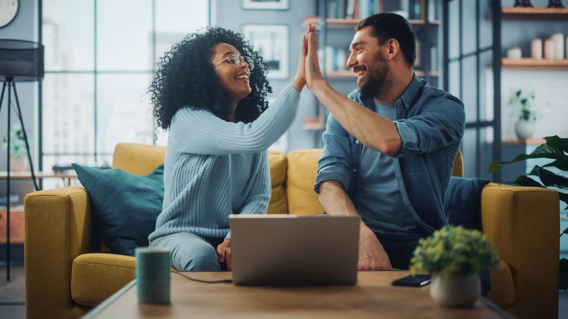 couple high fiving each other as they work together as a team