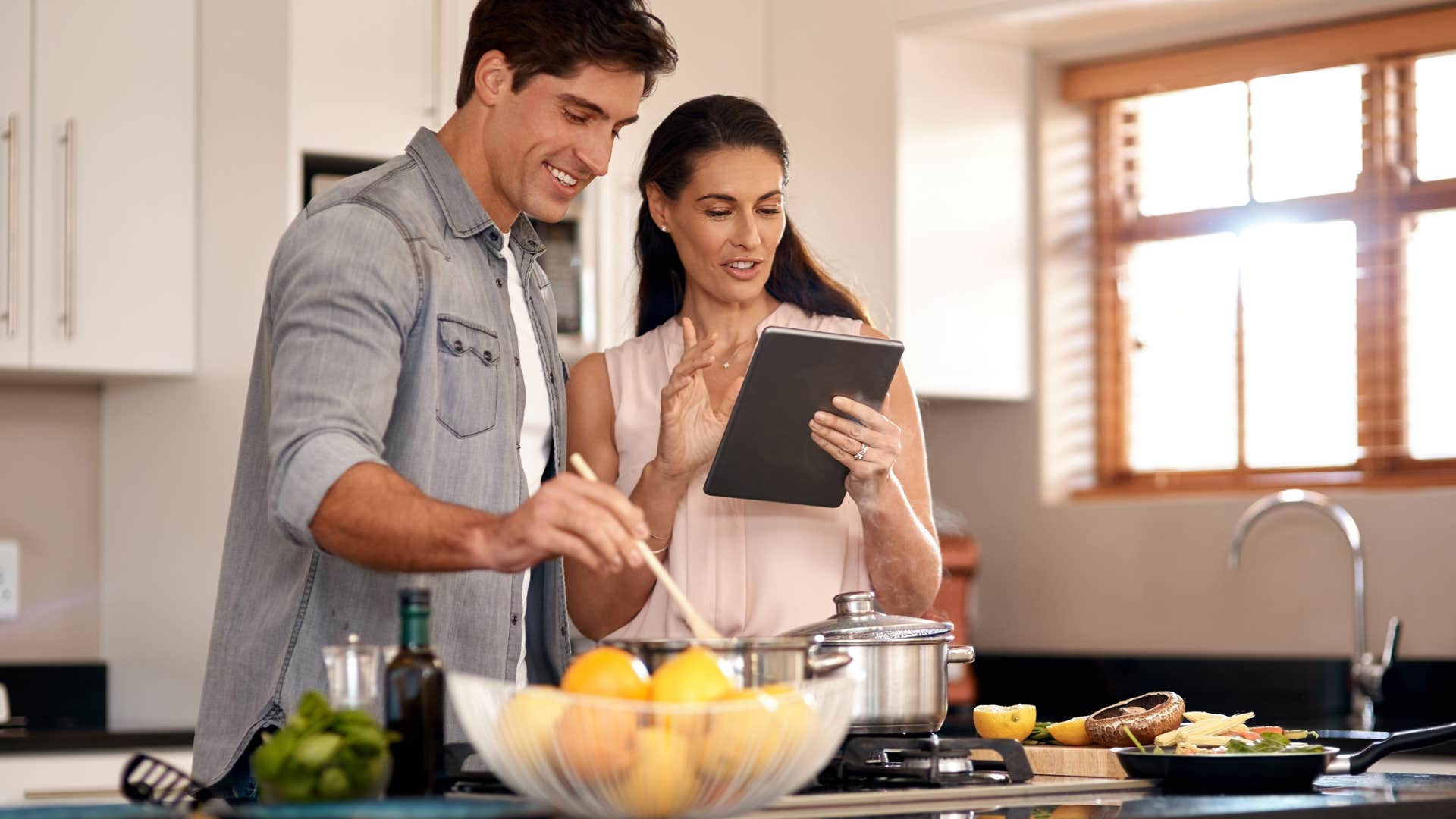couple following rules for an enduring relationship by making dinner