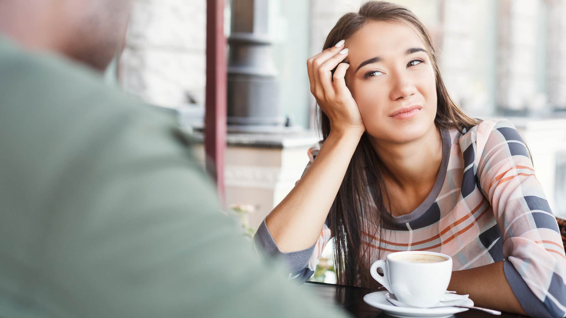 Woman who isn't excited about anything looking at her husband.