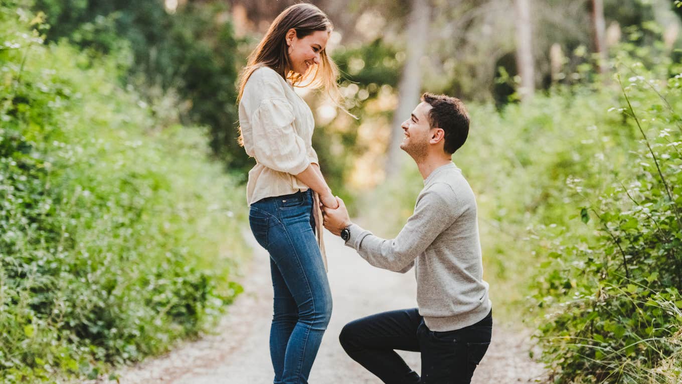 signs your partner is about to propose according to a marriage therapist man proposing to his girlfriend