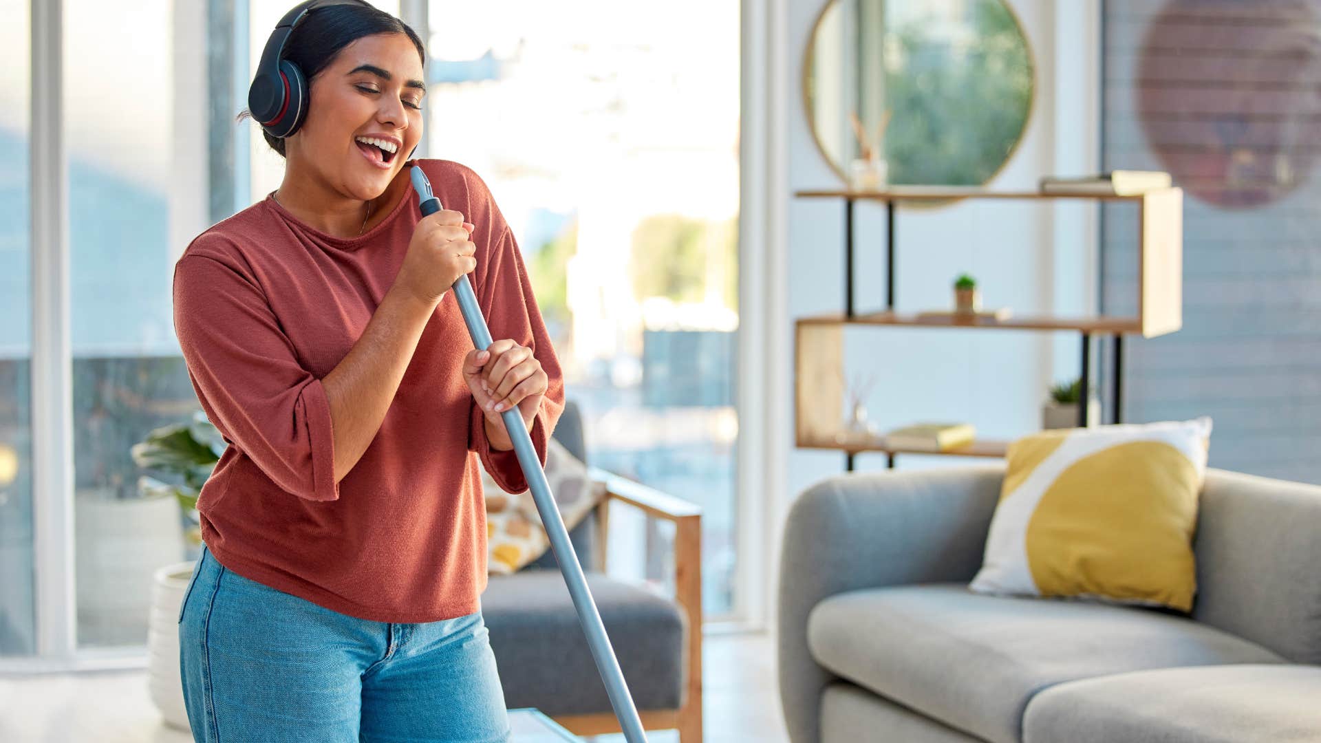 woman cleaning and listening to music
