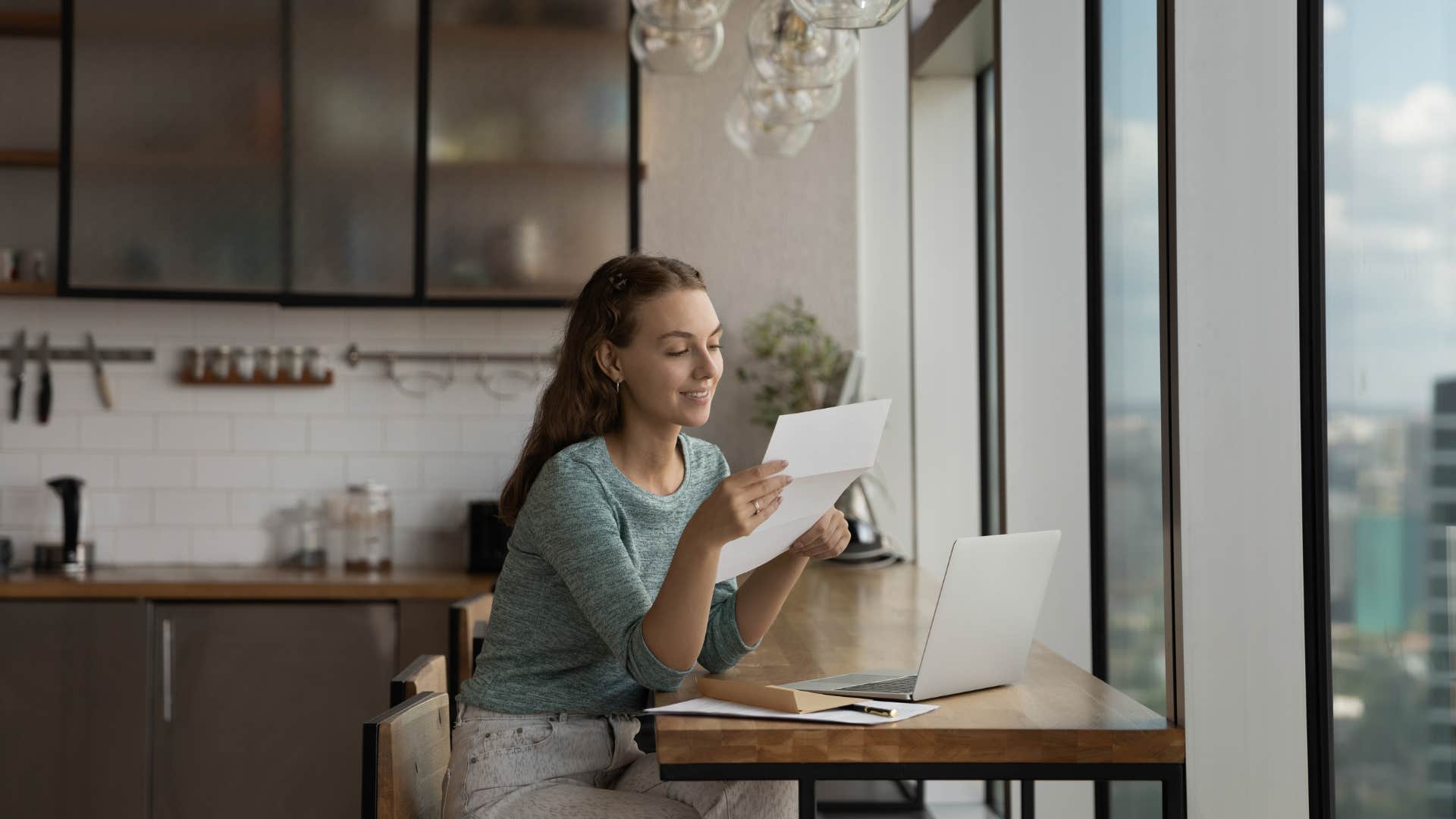 woman getting paycheck from job