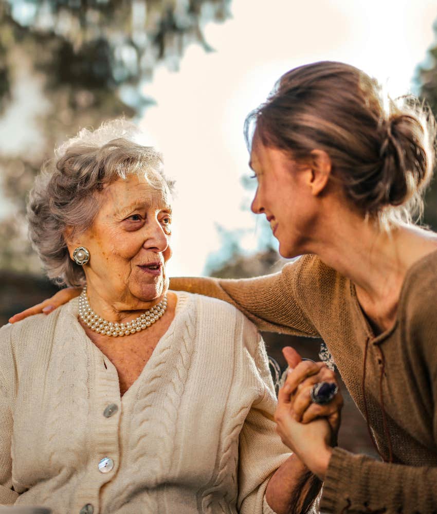 elderly woman with a younger hospice nurse