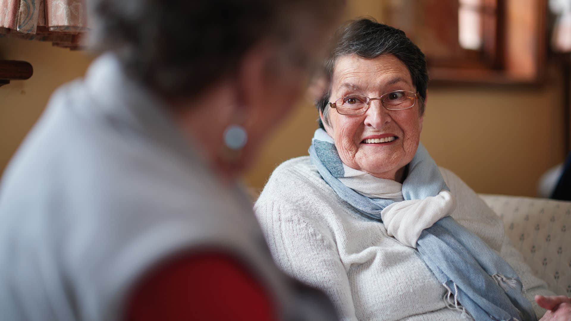 older woman in light shirt saying groovy