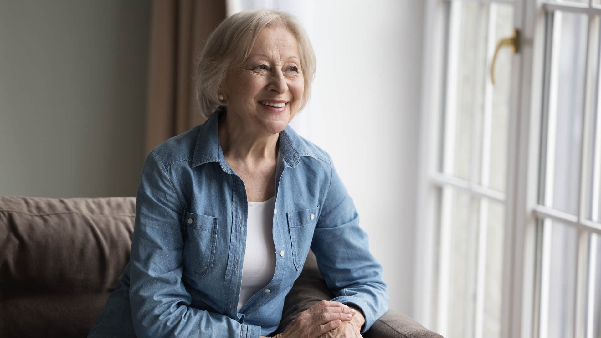 woman in white shirt slightly zonked out as she stares out window