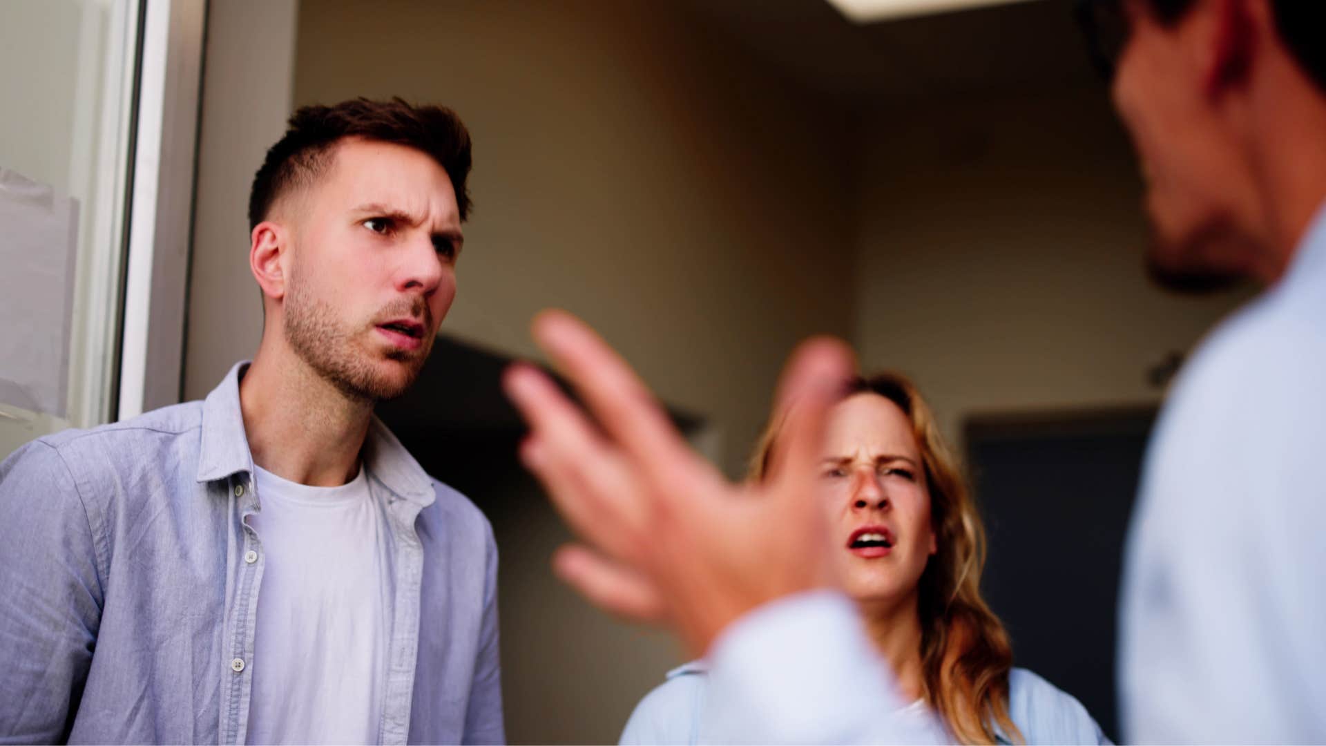 man interrupting people while they are speaking