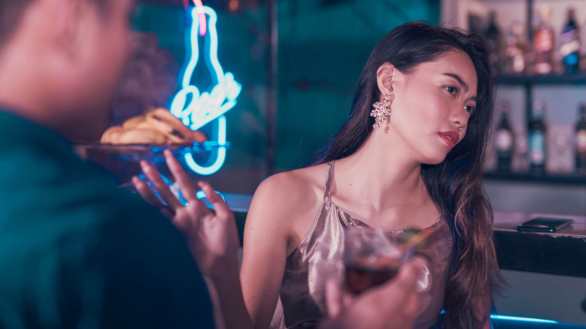 woman rejecting man at a bar after he refused to respect no