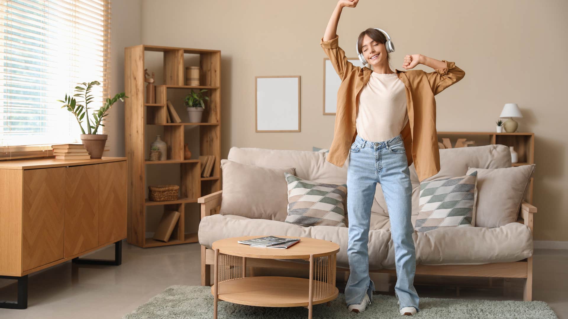 woman dancing and listening to music playlist