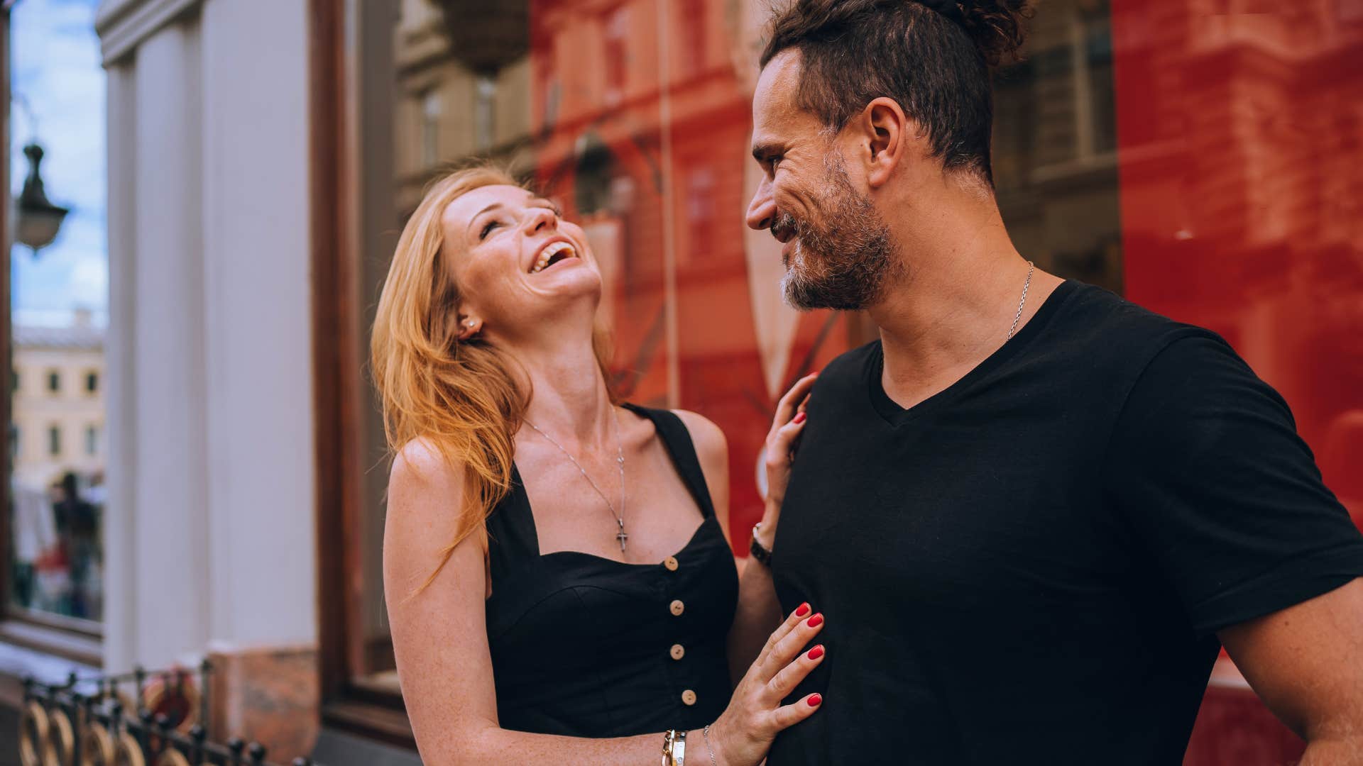 man showing he is attracted to woman by highlighting best attributes