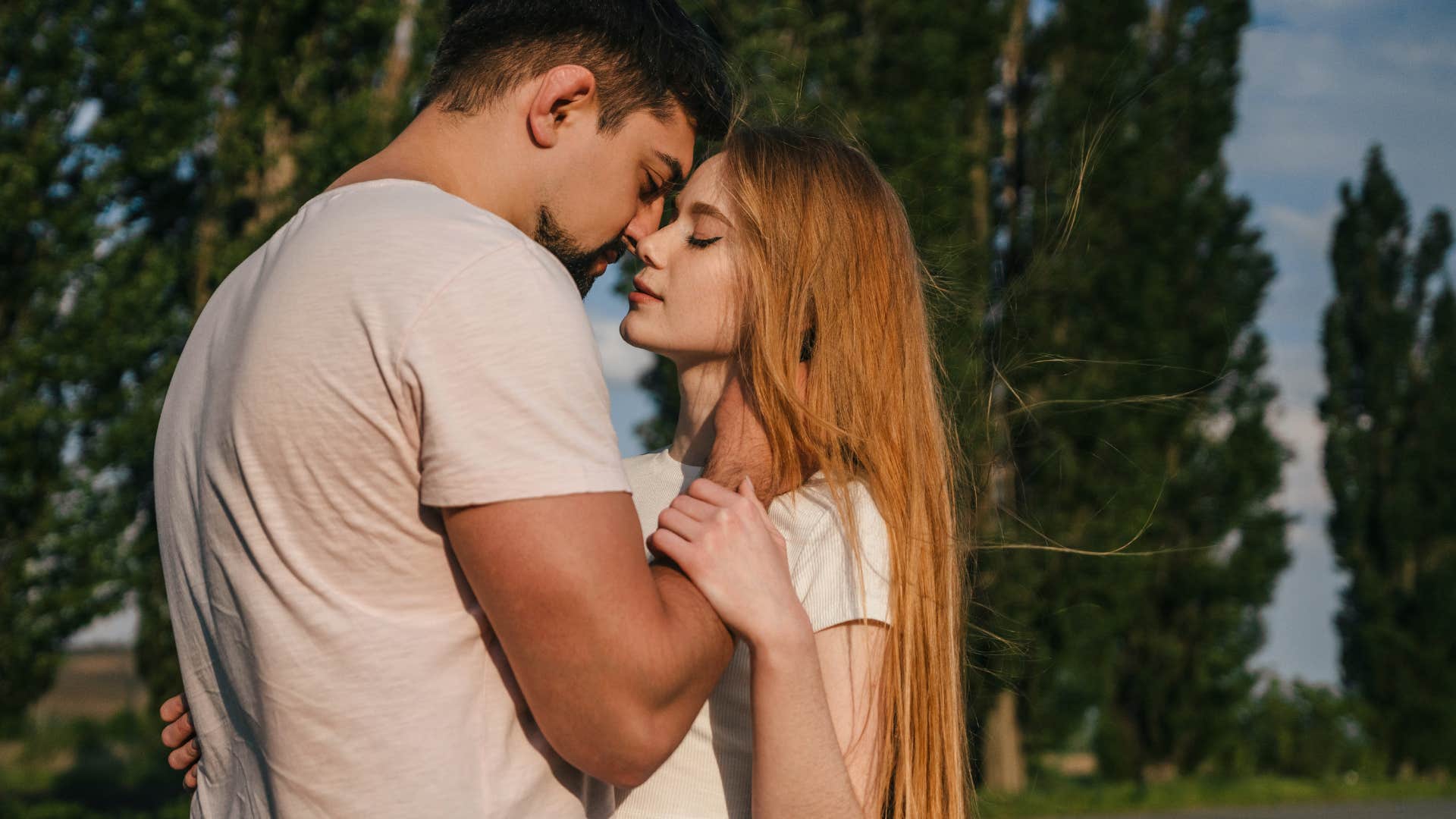 man who is attracted to woman and showing it with physical contact