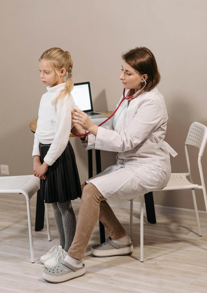 girl receiving treatment from doctor