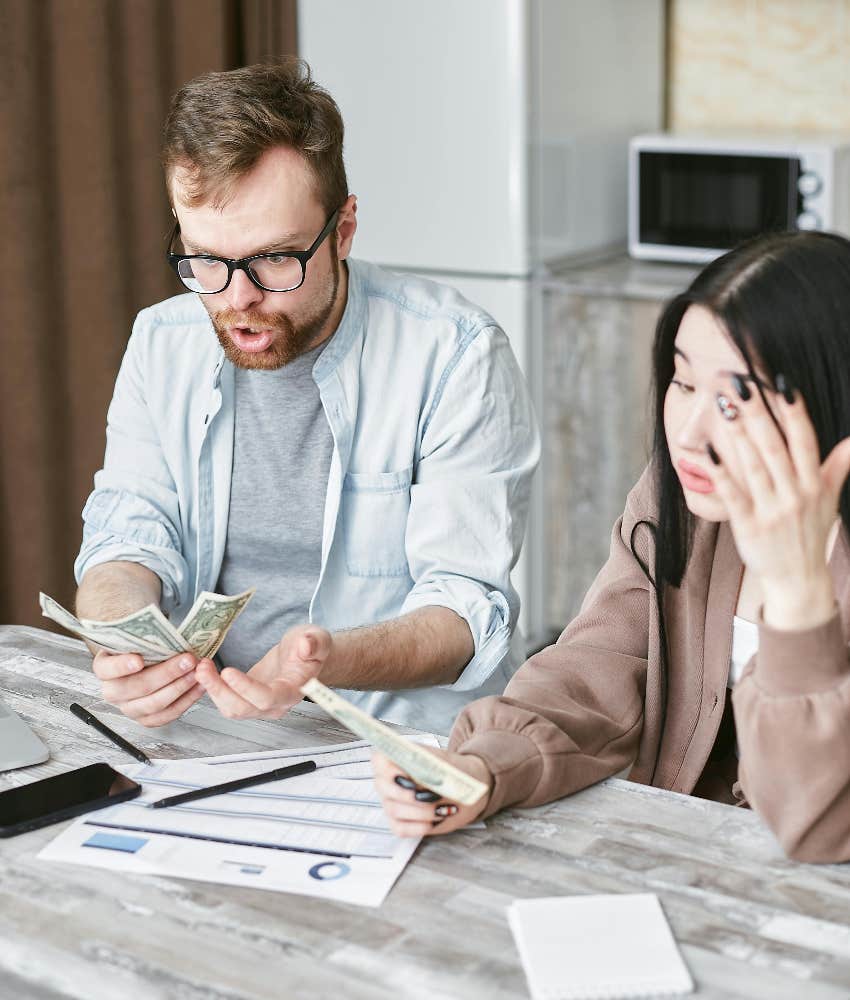 shocked couple paying their bills