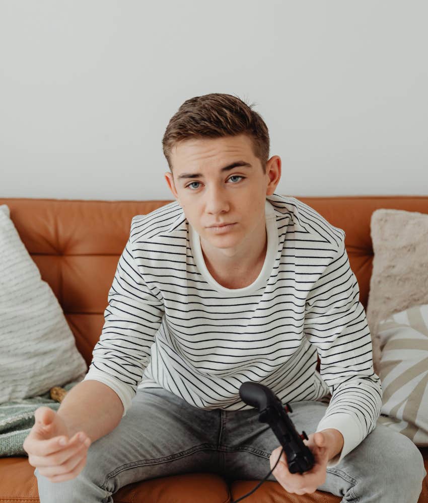 teen boy playing video games