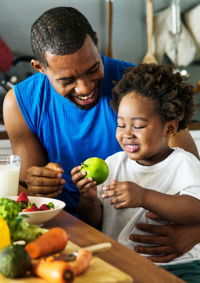 father teaching his son about healthy eating