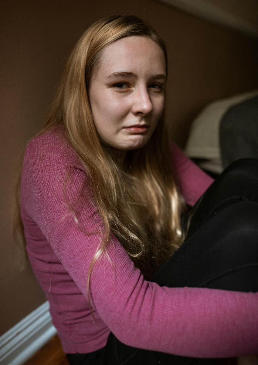 sad teen girl crying because her dad takes her money