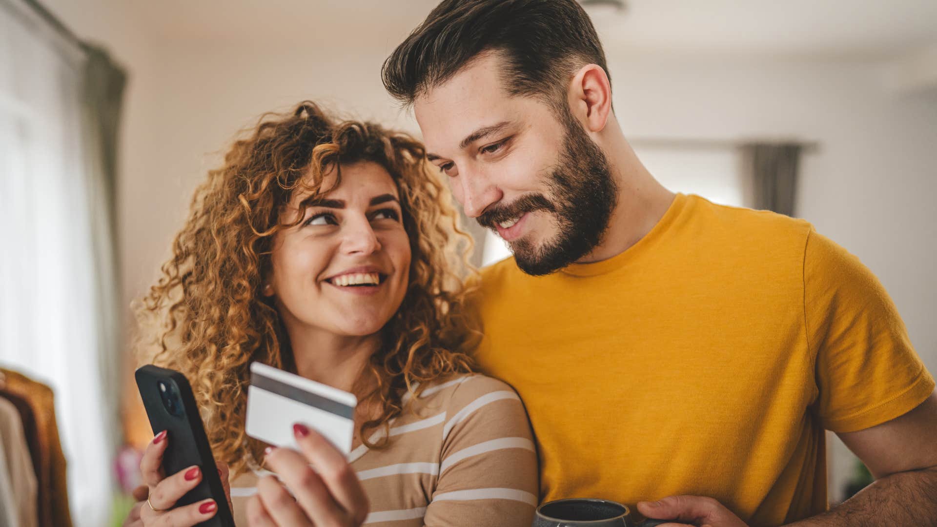 Woman saying "I trust your judgement" to her husband at home.