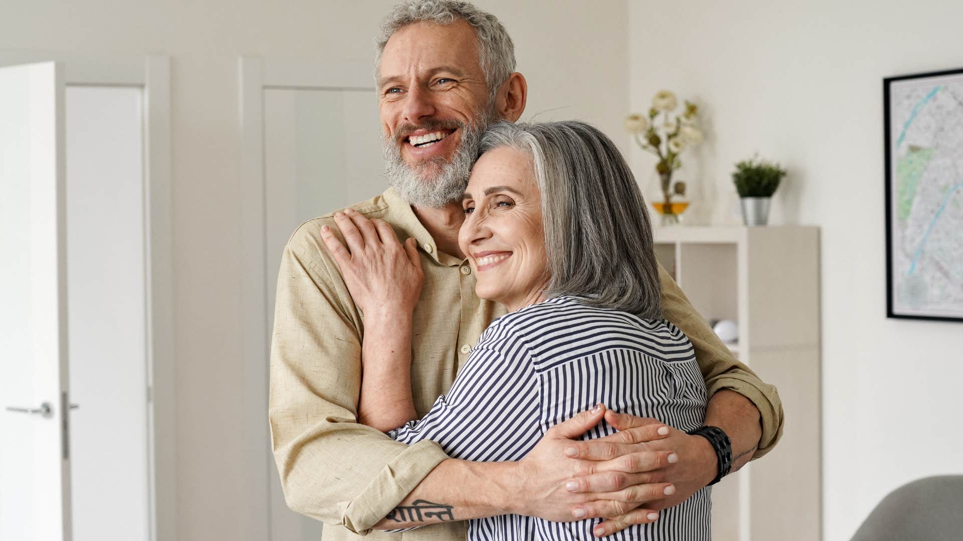 Woman saying "you've been doing so well" and hugging her husband.