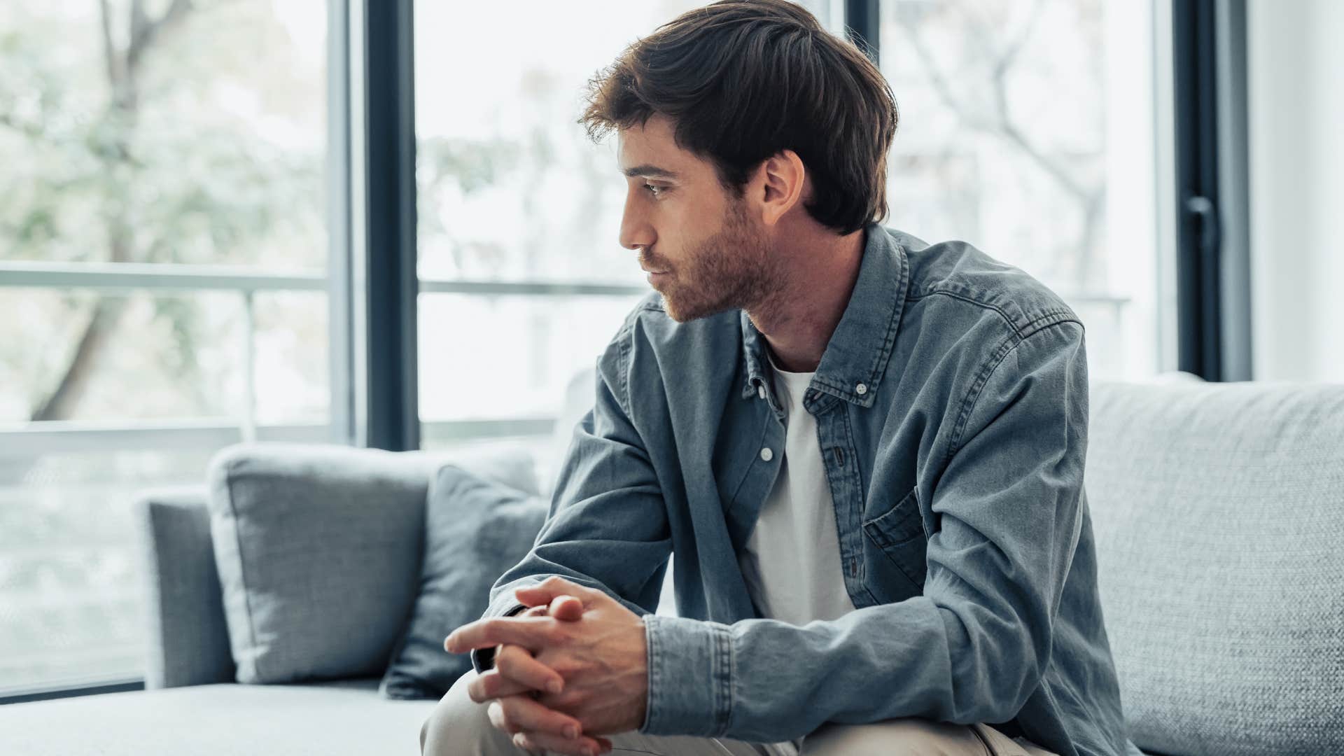 Man who spends more time alone sitting at home.