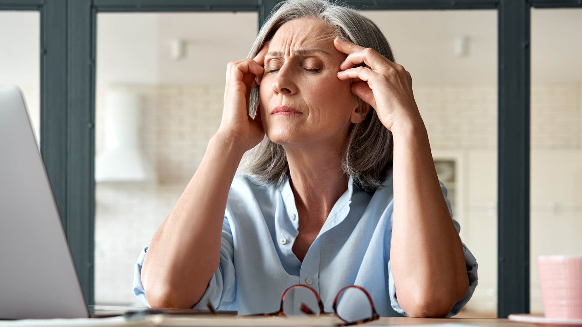 boomer woman on the phone talking about hard work equating to wealth
