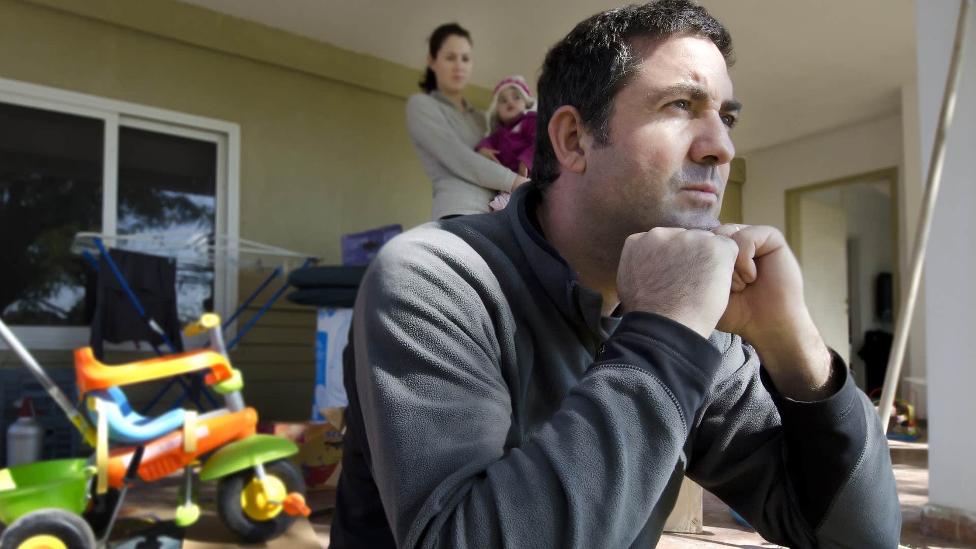 stressed low income man struggling with his family