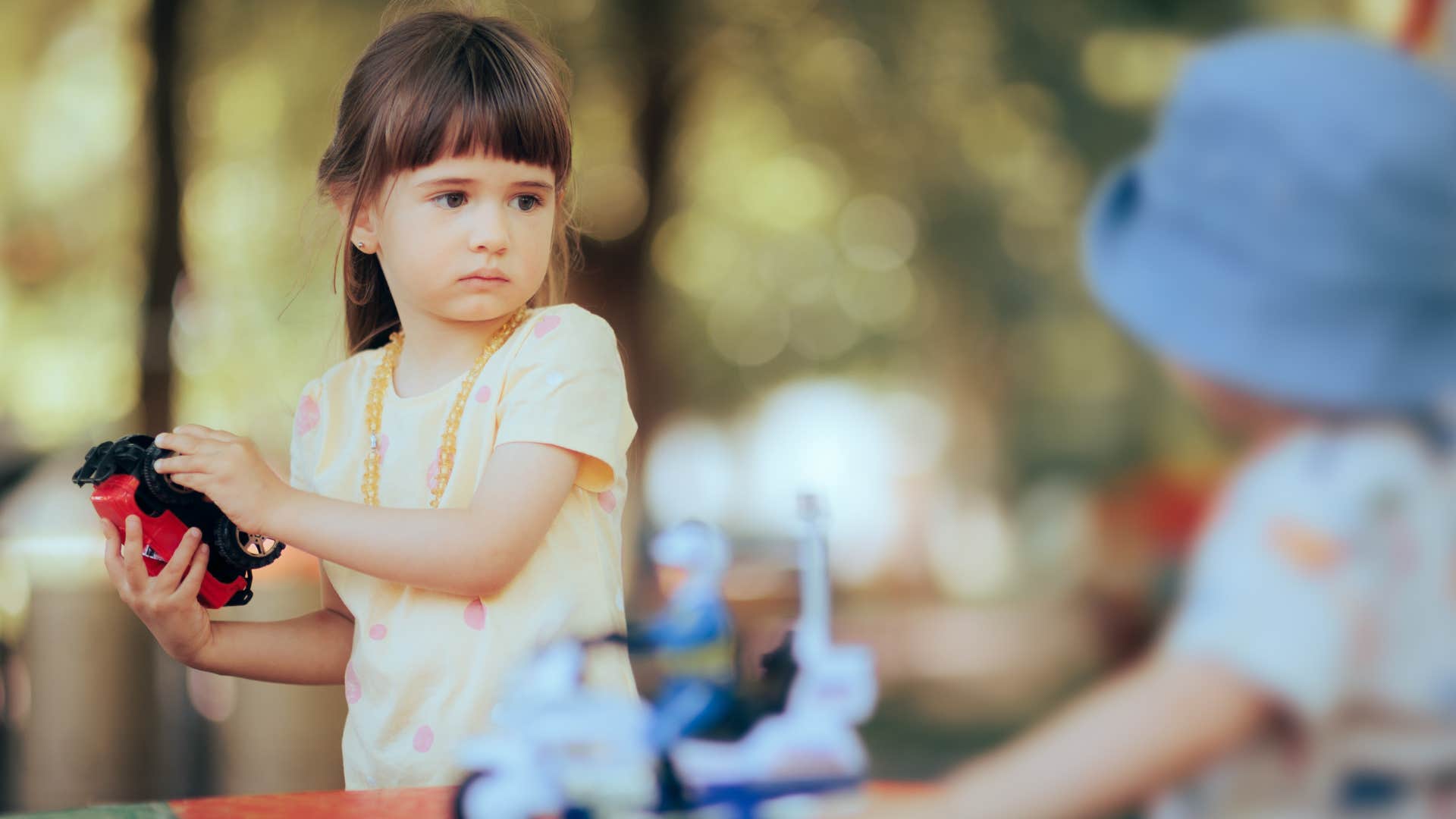 an entitled little girl refuses to share her toy car