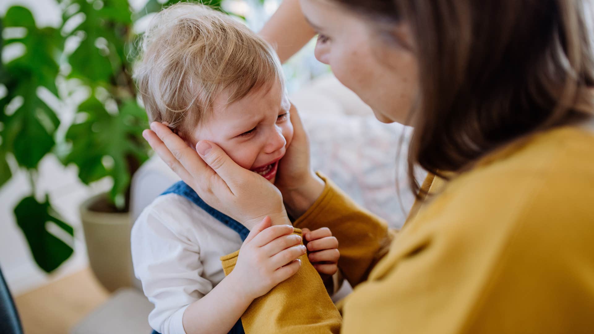 a little boy throws a tantrum in public and his mother offers to buy him something