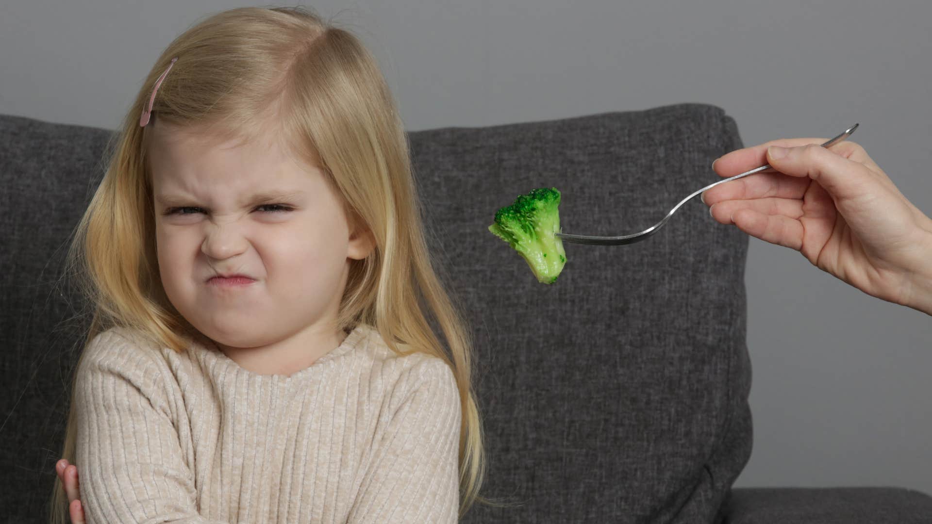 an entitled young girl refuses to eat vegetables that are good for her