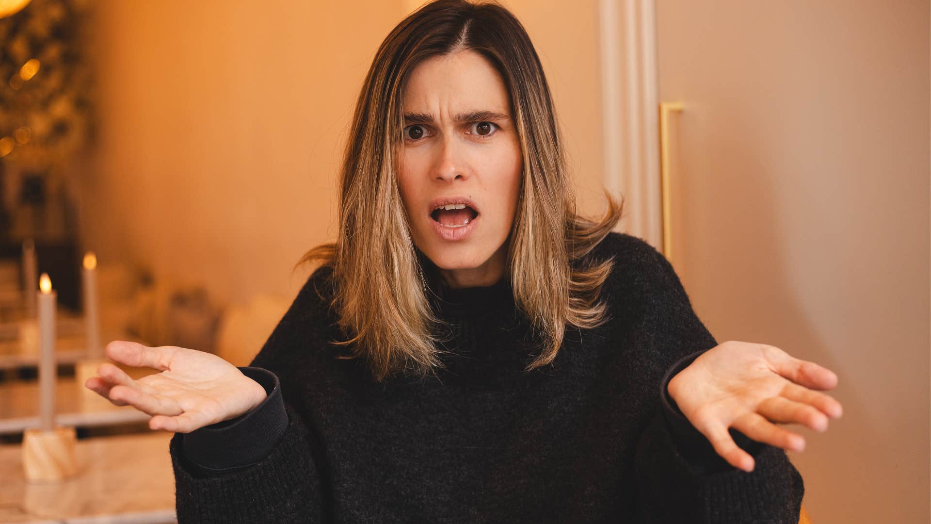 Woman who's not helping people without expectations shrugging.
