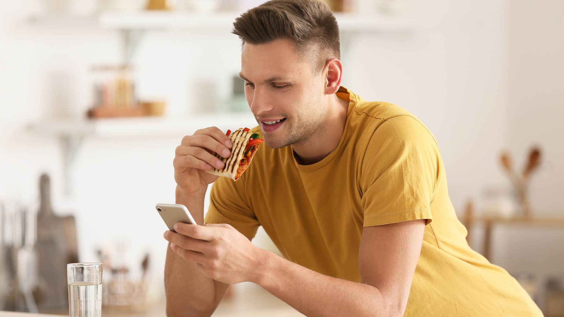 Man eating before leaving the house