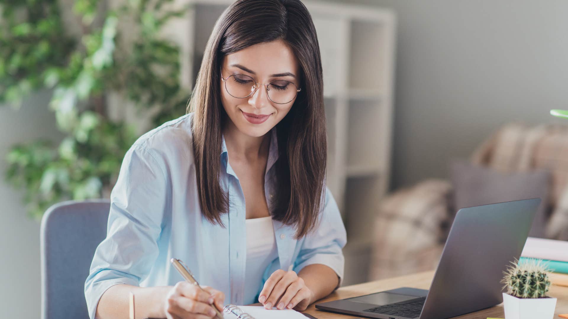 Woman making a to do list before leaving the house