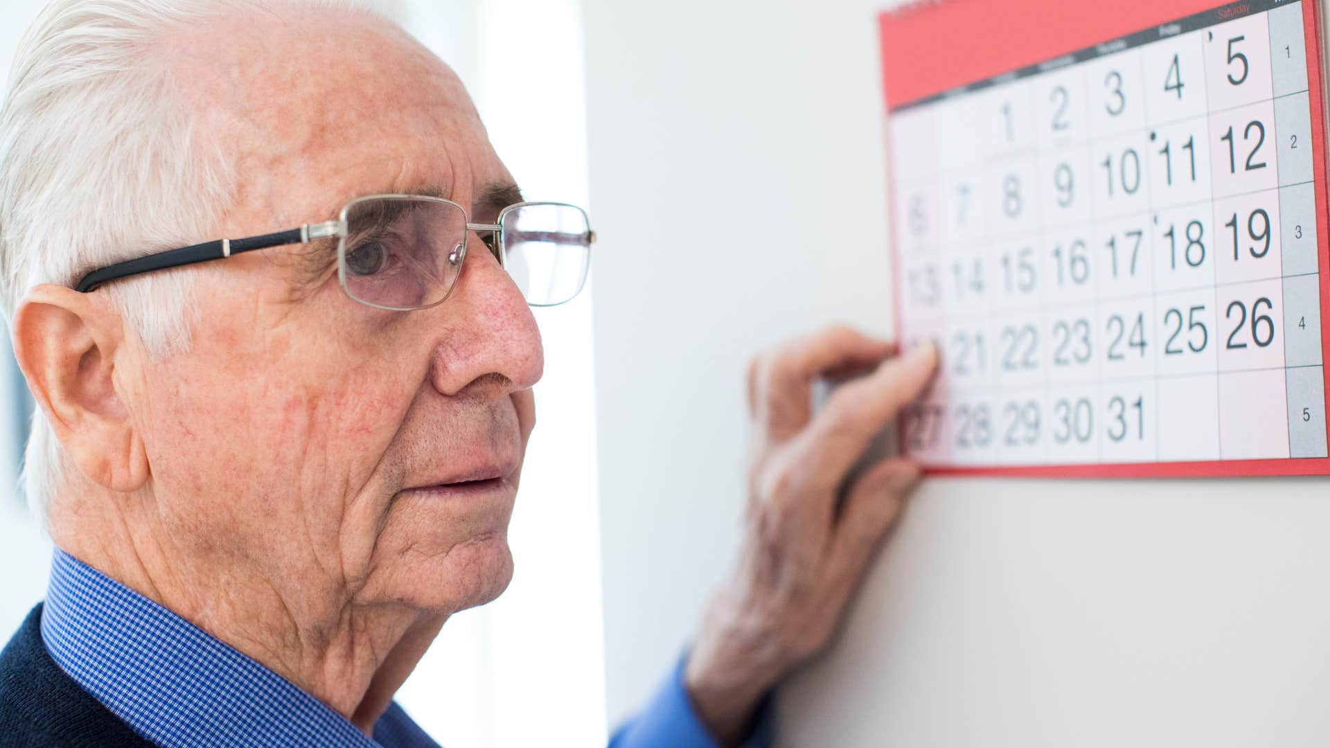 Man checking his calendar before he leaves the house