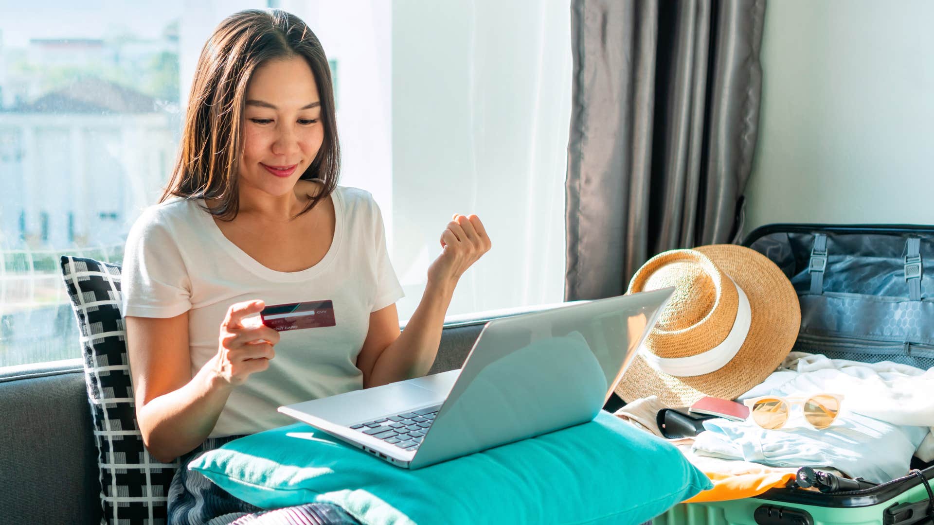 Woman booking travel tickets online.
